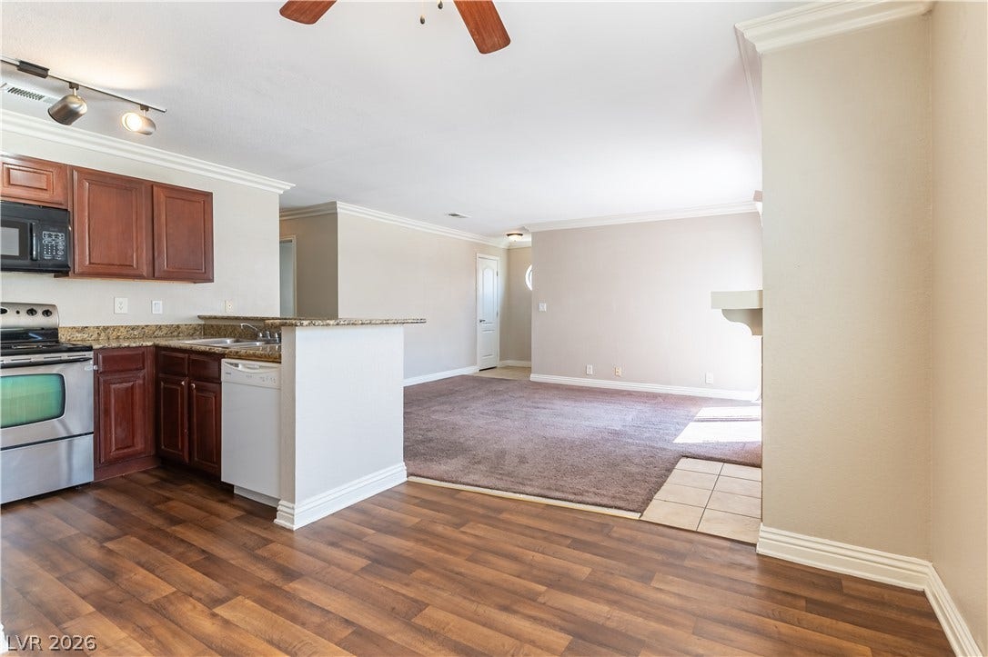 4050 Pacific Harbors Drive, #203, Las Vegas, NV 89121 Hardwood floors and clean crown molding enhance this open-concept layout.