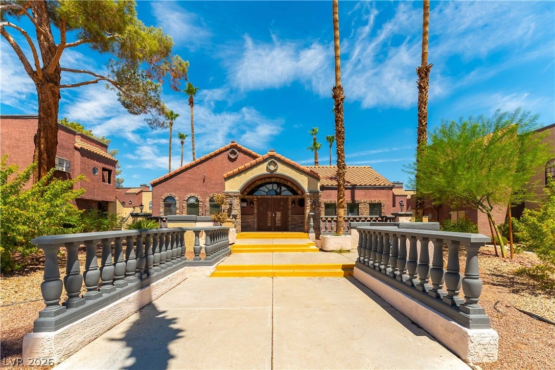 4050 Pacific Harbors Drive, #203, Las Vegas, NV 89121 A grand balustrade walkway guides the entry to this striking southwest-inspired exterior.