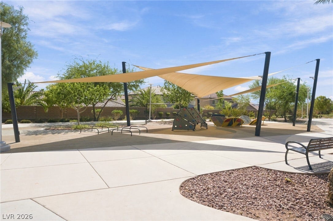 4216 Campriani Avenue, North Las Vegas, NV 89084 A modern shade structure covers a neighborhood recreational area adjacent to paved walking paths.