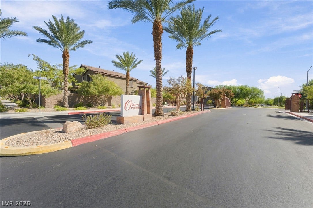 4216 Campriani Avenue, North Las Vegas, NV 89084 Towering palm trees flank the paved entrance of this gated residential neighborhood.