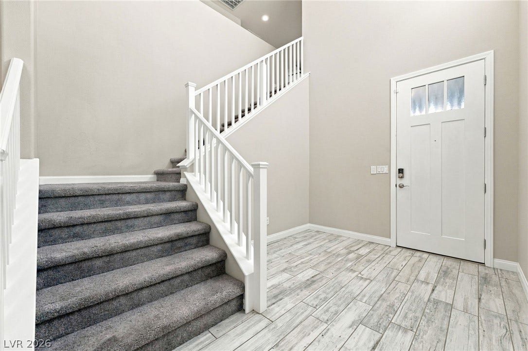 4216 Campriani Avenue, North Las Vegas, NV 89084 An inviting entryway welcomes guests with clean lines, high ceilings, and handsome wood-look tile flooring.