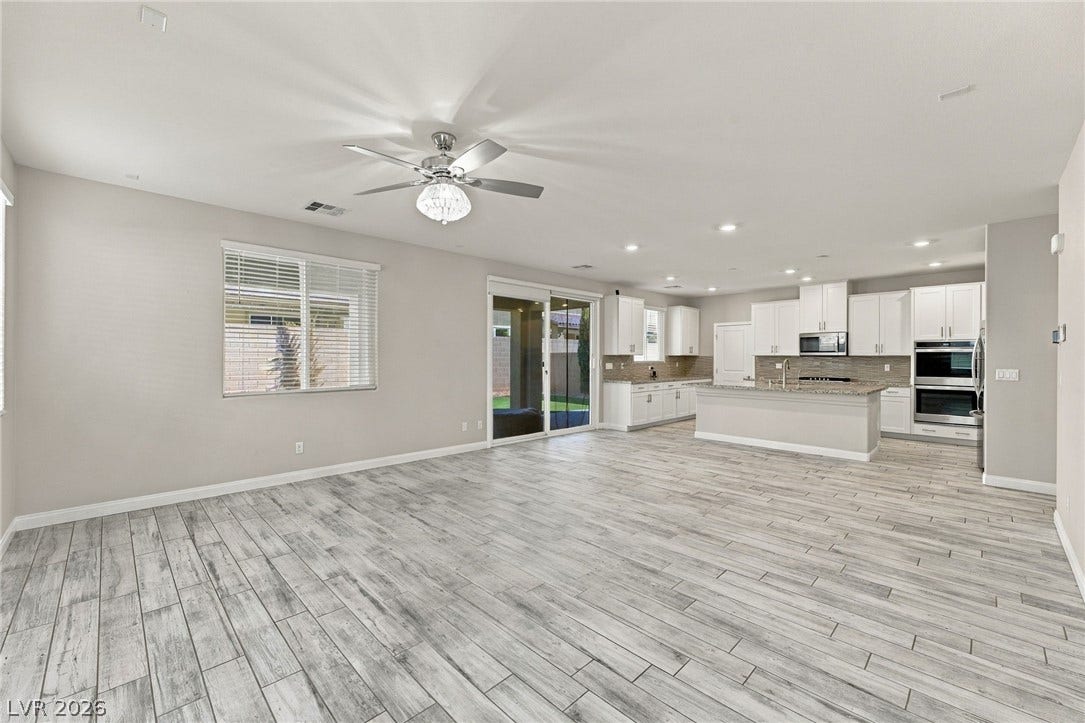 4216 Campriani Avenue, North Las Vegas, NV 89084 An open floorplan seamlessly connects the airy living area to a modern kitchen.
