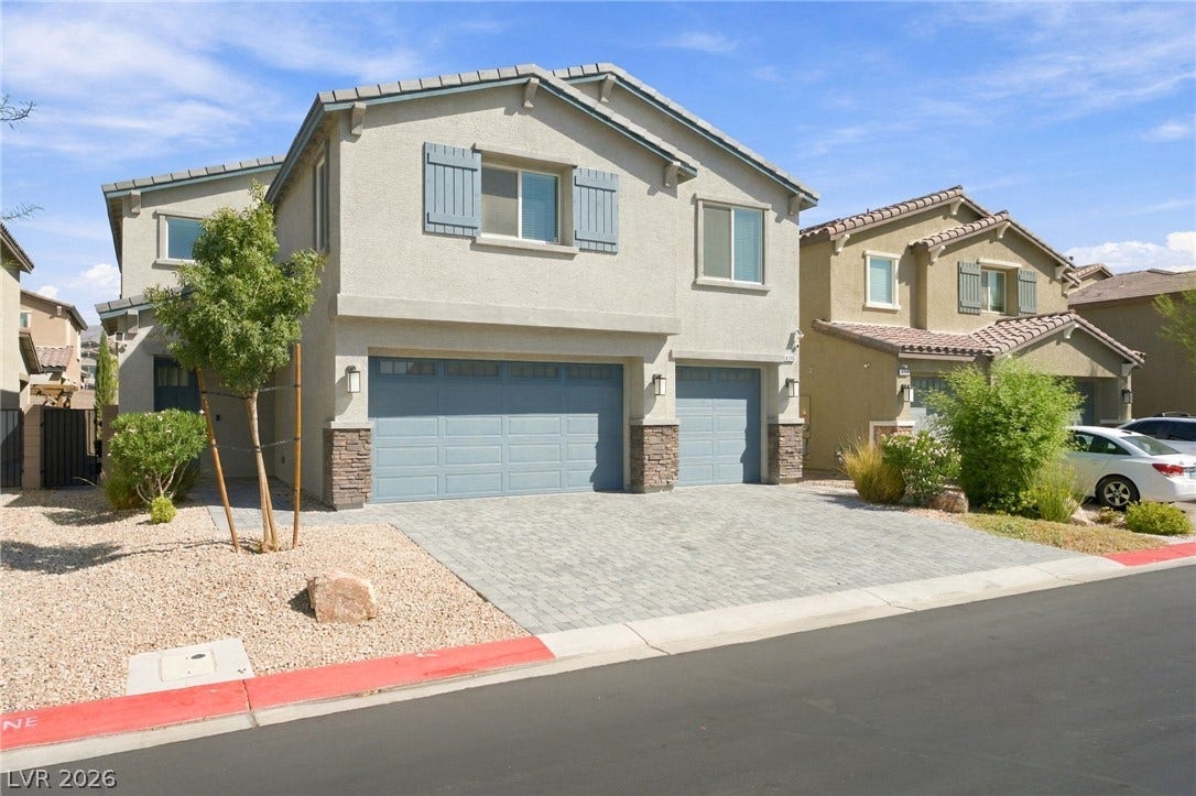 4216 Campriani Avenue, North Las Vegas, NV 89084 Attractive stone accents and a paved driveway enhance the exterior of this modern home.