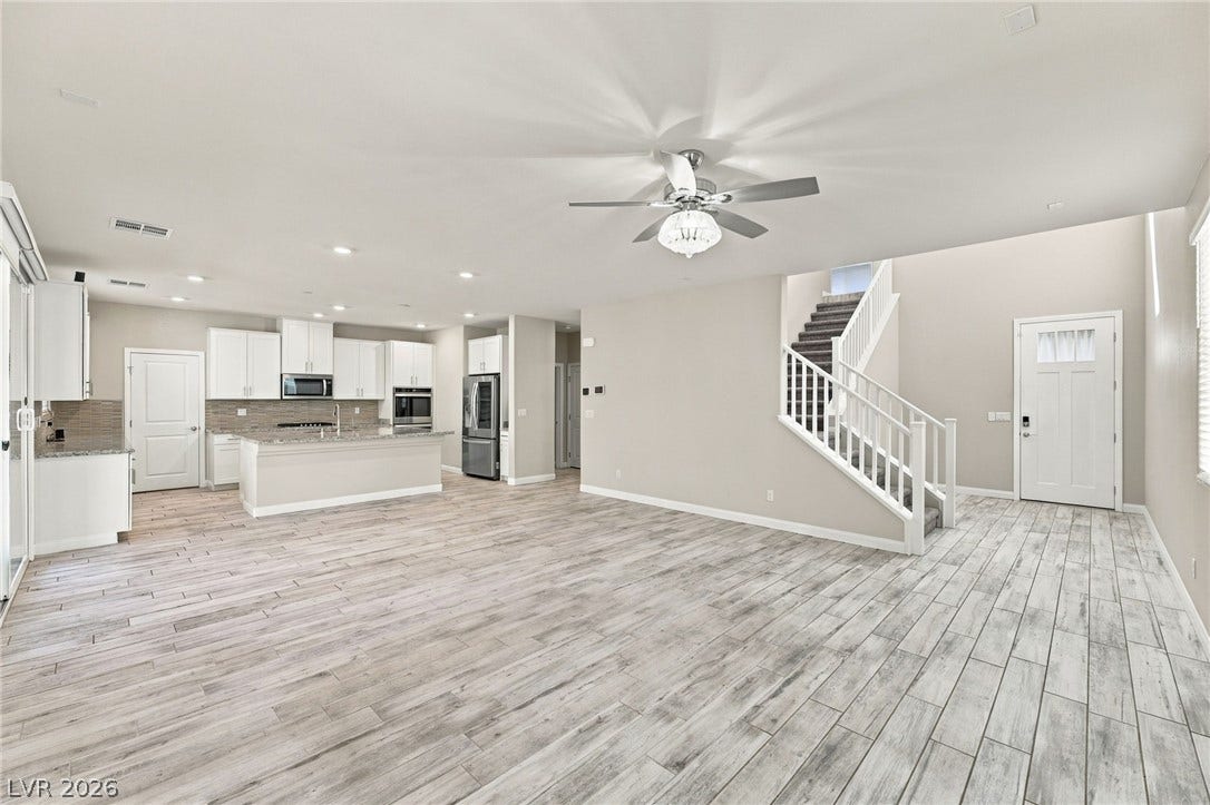 4216 Campriani Avenue, North Las Vegas, NV 89084 An airy open-concept layout connects the main living space seamlessly to the kitchen.