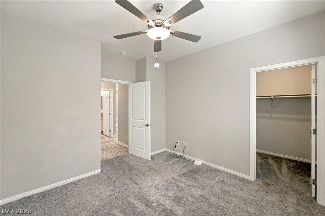 4216 Campriani Avenue, North Las Vegas, NV 89084 Soft carpeting underfoot provides cozy comfort in this bedroom with an attached closet.