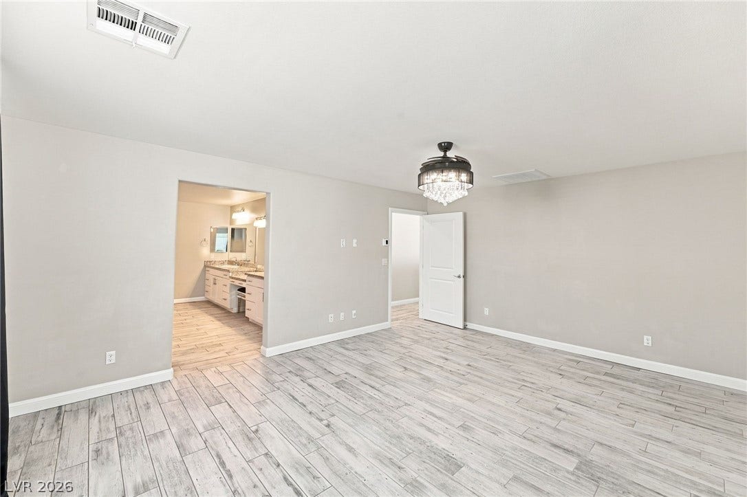 4216 Campriani Avenue, North Las Vegas, NV 89084 An open doorway connects this comfortable bedroom suite directly to the adjoining bath.