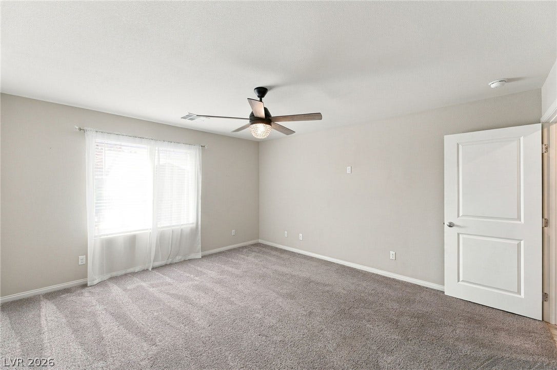 4216 Campriani Avenue, North Las Vegas, NV 89084 Plush wall-to-wall carpeting and neutral tones define this versatile secondary bedroom space.