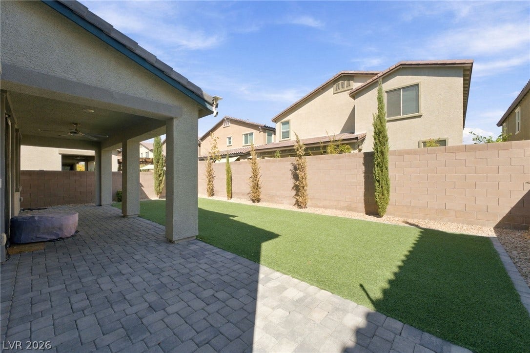 4216 Campriani Avenue, North Las Vegas, NV 89084 An inviting covered patio opens to a low-maintenance backyard enclosed by block fencing.