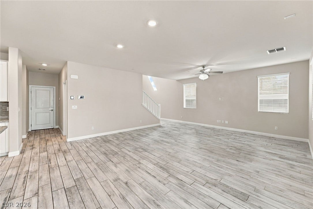 4216 Campriani Avenue, North Las Vegas, NV 89084 Clean lines and durable tile flooring define this airy open-concept living space.
