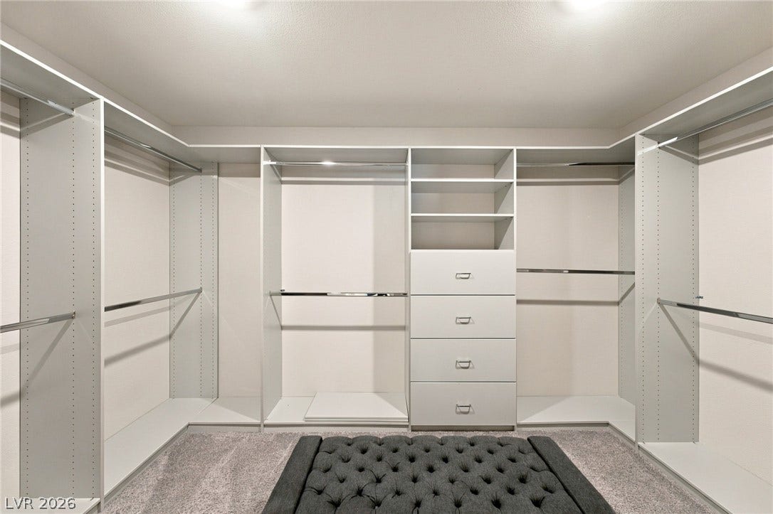 4216 Campriani Avenue, North Las Vegas, NV 89084 Ample built-in shelving and custom drawers organize this spacious closet.