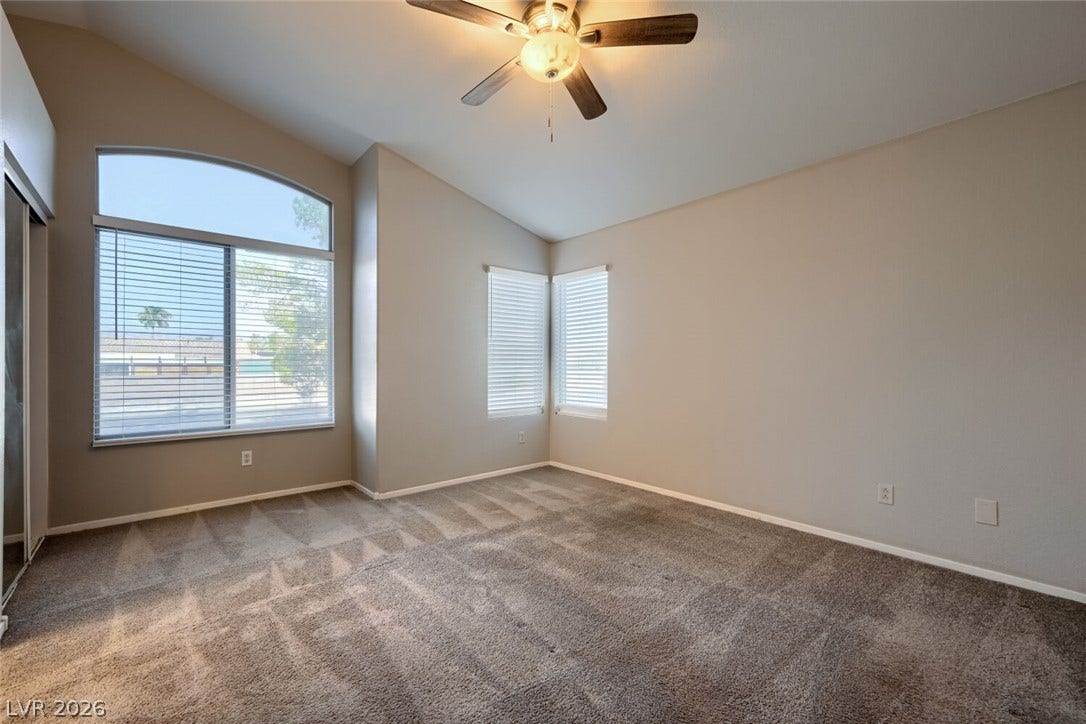6027 Dawn View Lane, North Las Vegas, NV 89031 Vaulted ceilings and soft plush carpeting define this comfortable and inviting bedroom space.