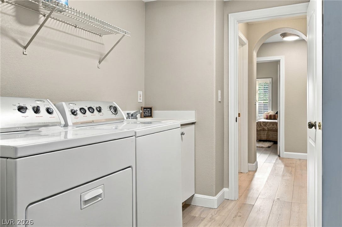 Functional workspace with built-in cabinetry and durable flooring connects seamlessly to the hallway.