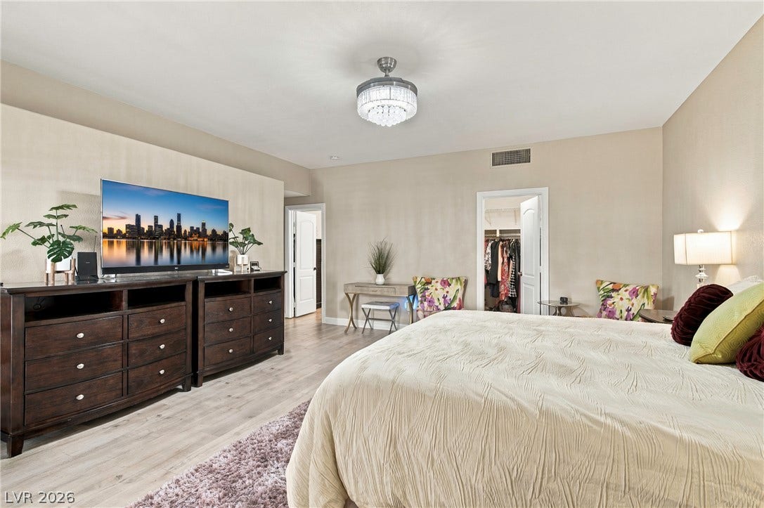 Primary bedroom with two walk-in closets.