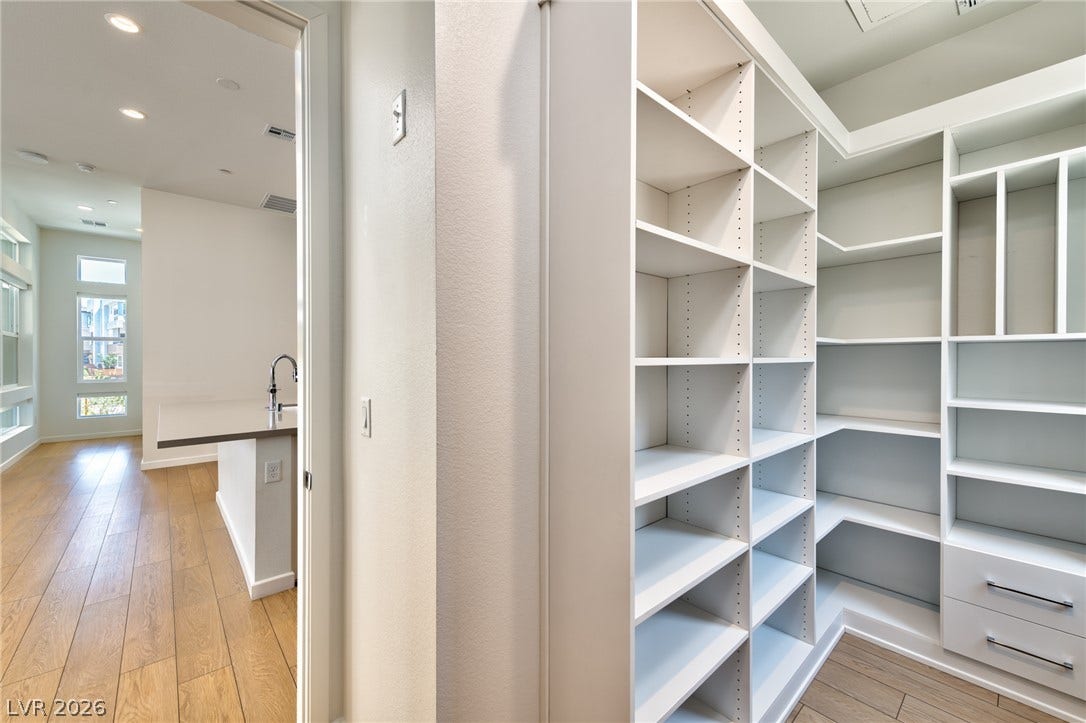 3327 Esker Ridge Avenue, Henderson, NV 89044 Extensive custom shelving offers abundant storage options in this walk-in pantry.