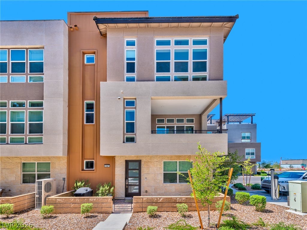 3327 Esker Ridge Avenue, Henderson, NV 89044 Striking contemporary architecture defines this multi-level home highlighted by stone accents and expansive windows.