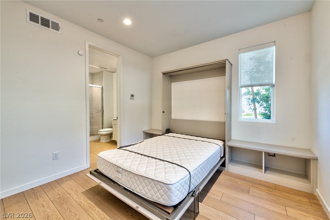 3327 Esker Ridge Avenue, Henderson, NV 89044 Warm wood flooring and clean architectural lines define this versatile space with adjoining bath access.
