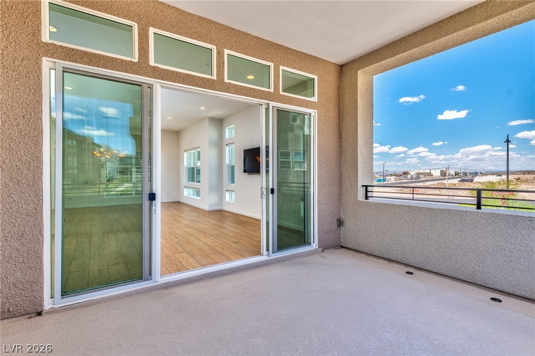 3327 Esker Ridge Avenue, Henderson, NV 89044 A spacious covered balcony provides effortless transitions to indoor living space.