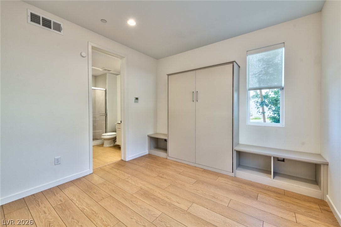 3327 Esker Ridge Avenue, Henderson, NV 89044 Smooth wood floors and recessed lighting enhance this versatile space adjoining a bathroom.