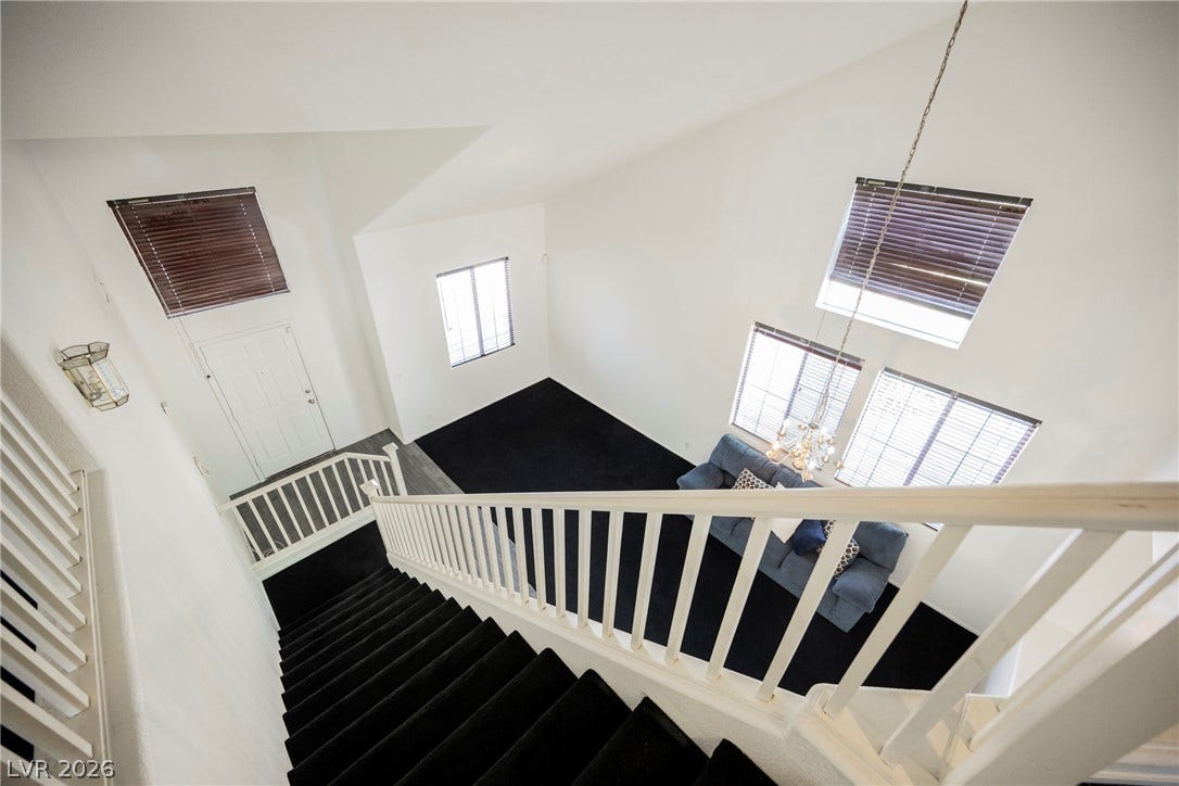 1608 Saddle Rock Circle, Las Vegas, NV 89117 Dramatic vaulted ceilings and abundant natural light define this welcoming split-level entryway.