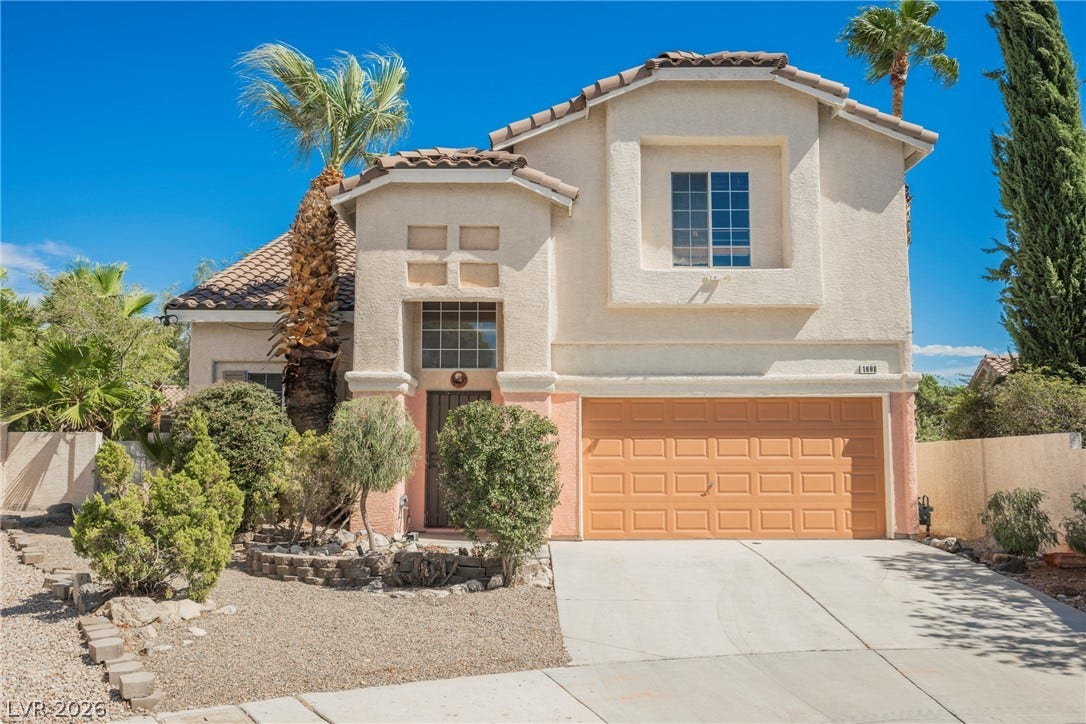 1608 Saddle Rock Circle, Las Vegas, NV 89117 Spanish tile roofing and stucco exterior walls create classic desert charm.