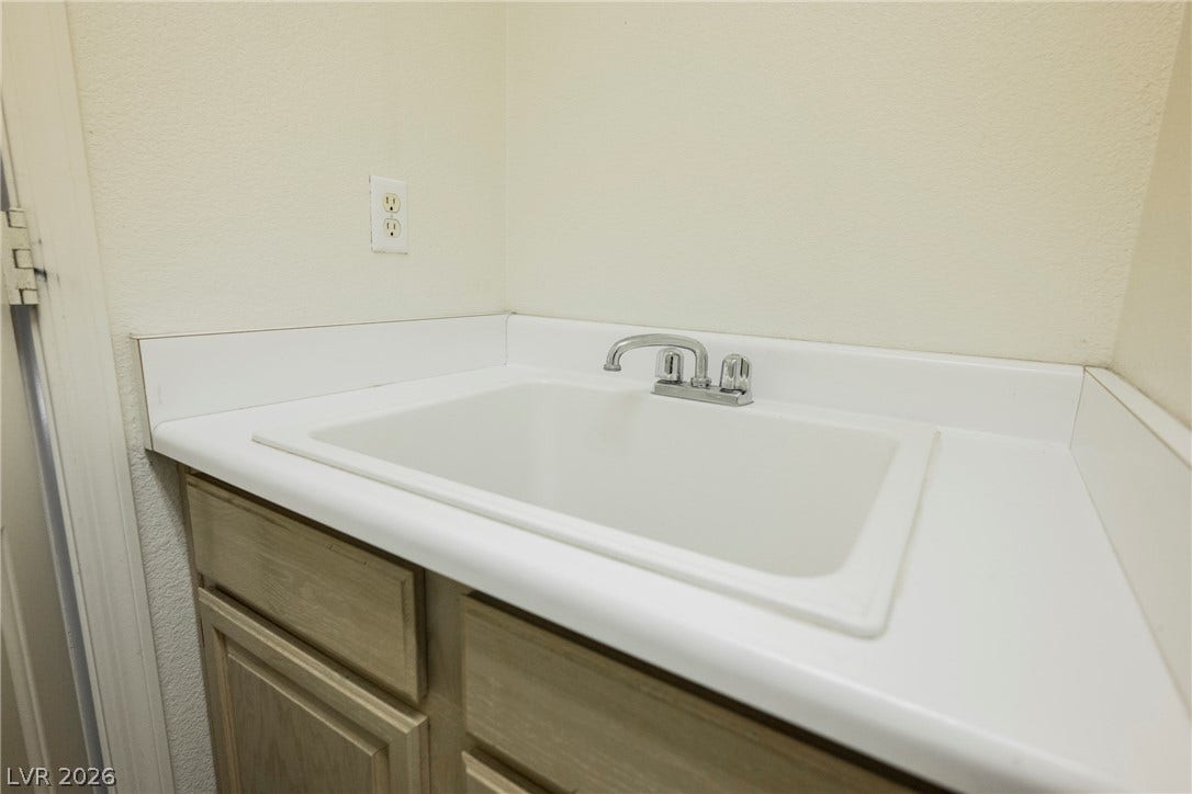 1608 Saddle Rock Circle, Las Vegas, NV 89117 A deep utility sink inset within a durable countertop provides excellent functional utility.