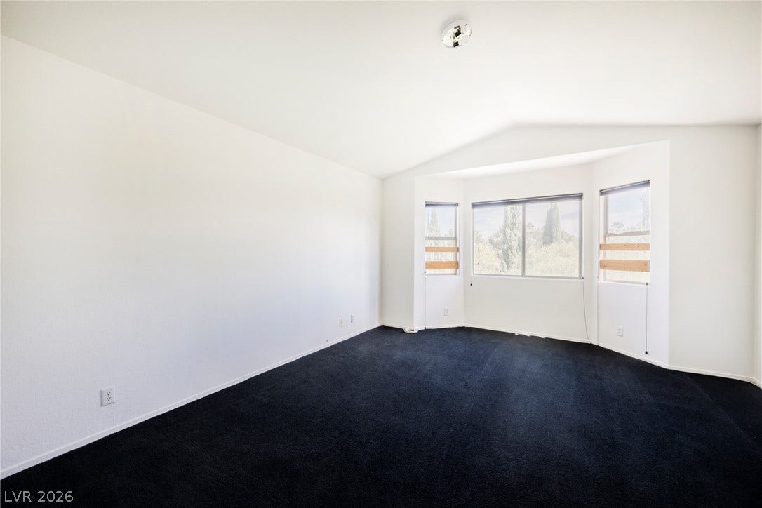 1608 Saddle Rock Circle, Las Vegas, NV 89117 Crisp walls and plush dark carpeting define this peaceful space framed by a classic bay window.