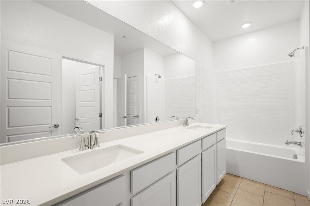 1429 Bianca Falls Drive, Henderson, NV 89011 Clean lines and a spacious dual vanity define this modern bathroom.