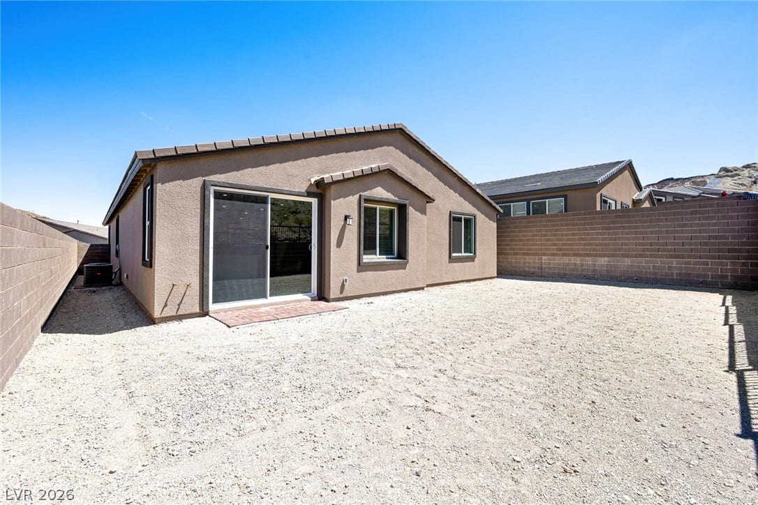 1429 Bianca Falls Drive, Henderson, NV 89011 A low-maintenance gravel yard is fully enclosed by privacy block walls.