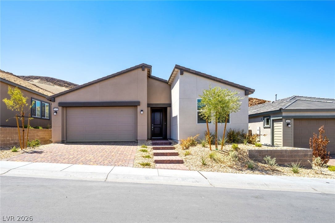 1429 Bianca Falls Drive, Henderson, NV 89011 Modern desert architecture combines with a low-maintenance landscape for pristine curb appeal.