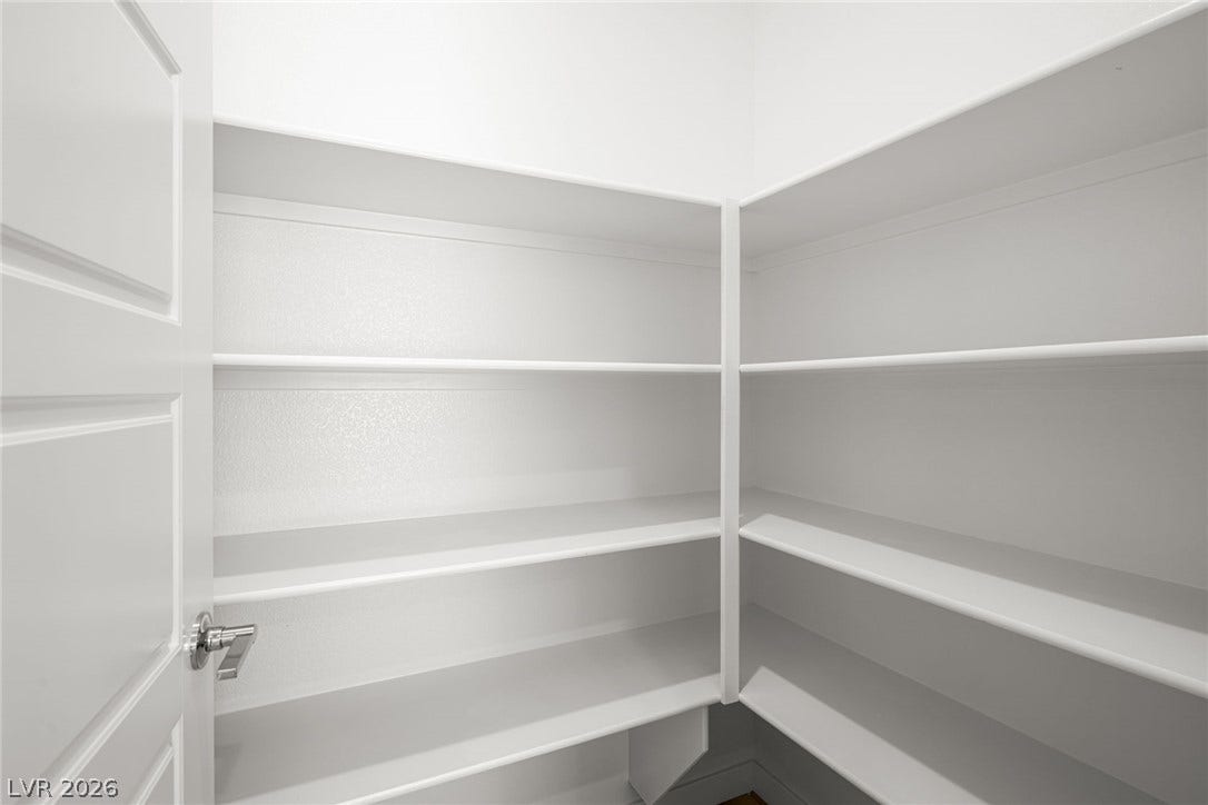 1429 Bianca Falls Drive, Henderson, NV 89011 Ample built-in shelving wraps around this walk-in storage area.