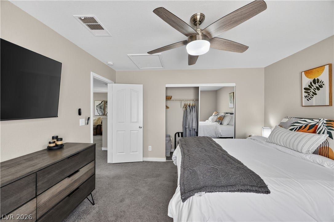 530 Rancho Del Mar Way, North Las Vegas, NV 89031 Soft carpeting pairs with neutral walls in this comfortable bedroom featuring a mirrored closet.