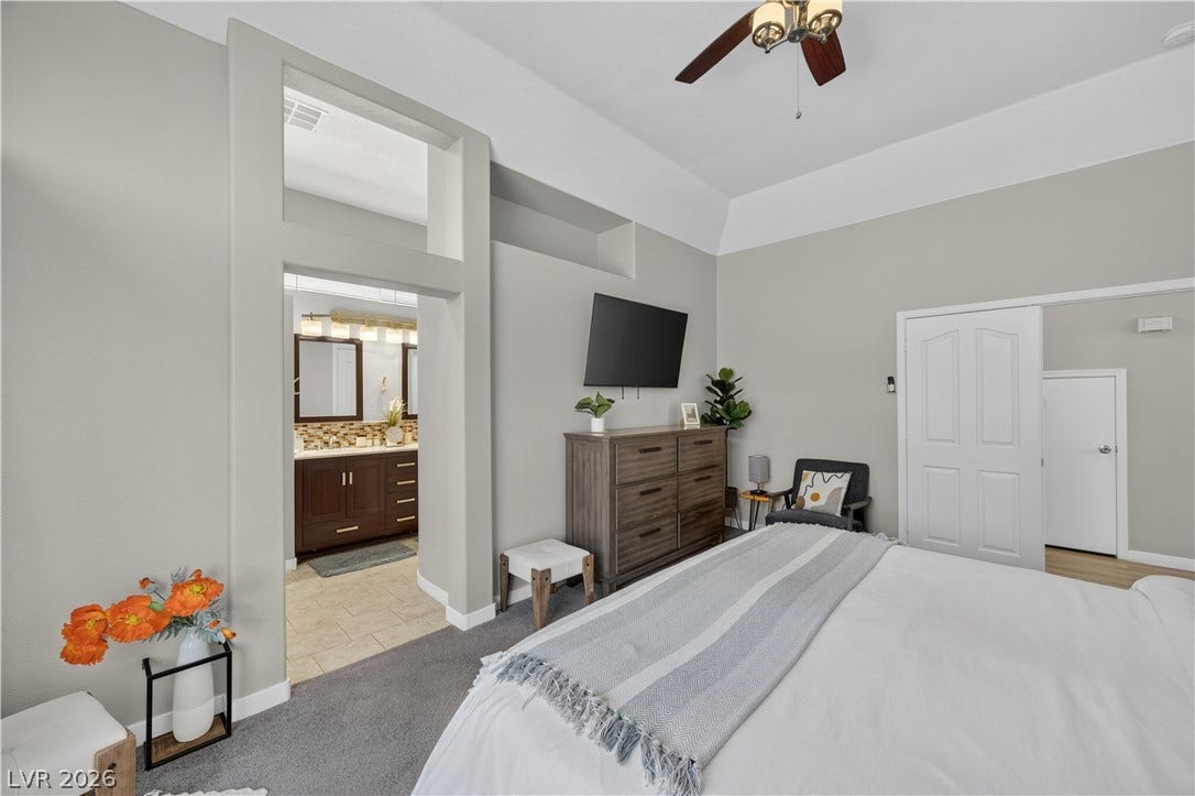 530 Rancho Del Mar Way, North Las Vegas, NV 89031 High ceilings and soft carpet floor define this comfortable main bedroom space.