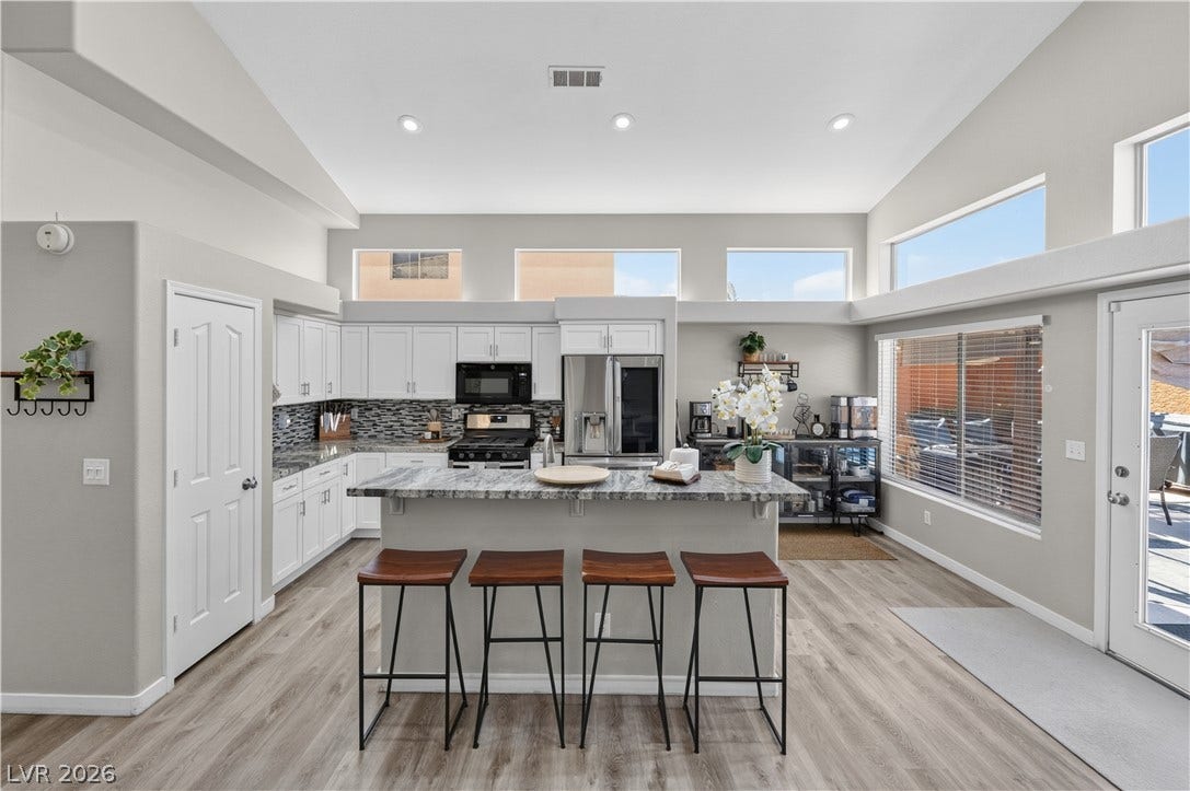 530 Rancho Del Mar Way, North Las Vegas, NV 89031 Angled ceilings and high clerestory windows bring architectural interest to this bright kitchen space.