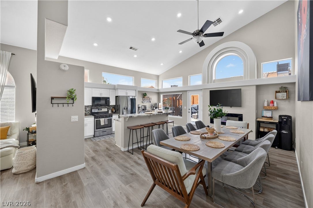 530 Rancho Del Mar Way, North Las Vegas, NV 89031 Soaring vaulted ceilings and durable wood-look flooring enhance this light-filled open concept space.