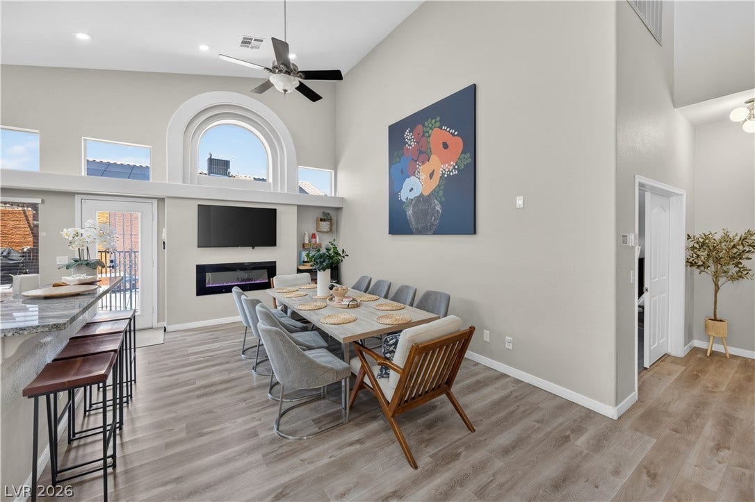 530 Rancho Del Mar Way, North Las Vegas, NV 89031 Vaulted ceilings and a signature arched window elevate this versatile dining space.