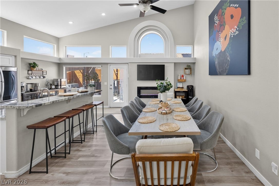 530 Rancho Del Mar Way, North Las Vegas, NV 89031 High ceilings and a custom arched window elevate this open dining area.