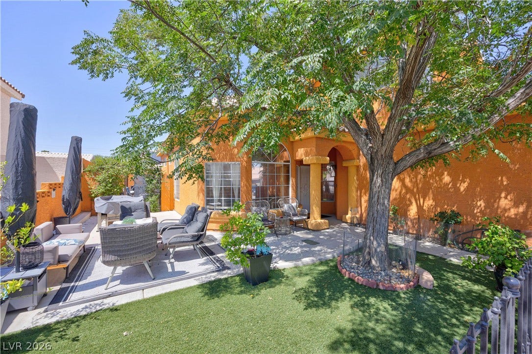 530 Rancho Del Mar Way, North Las Vegas, NV 89031 Mature trees shade a welcoming paved patio area perfect for outdoor relaxation.