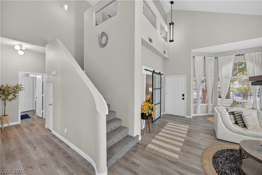 530 Rancho Del Mar Way, North Las Vegas, NV 89031 An open entryway showcases soaring vaulted ceilings and a stylish modern staircase layout.