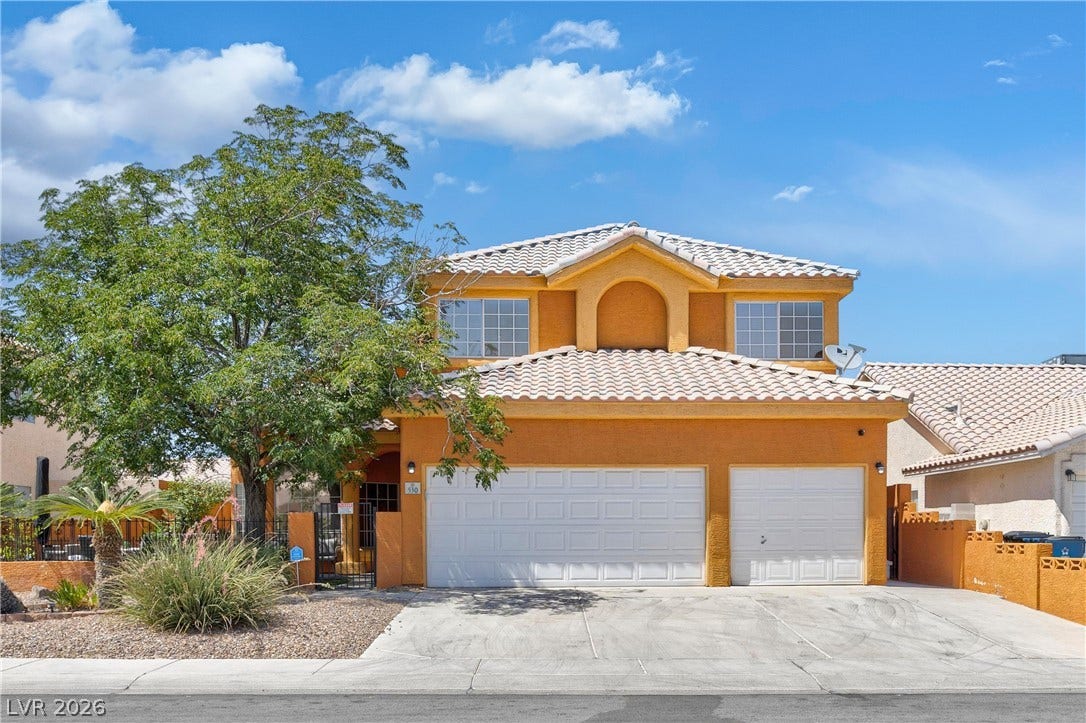 530 Rancho Del Mar Way, North Las Vegas, NV 89031 Spanish tile roofing and classic stucco exterior define this multi-level suburban residence.