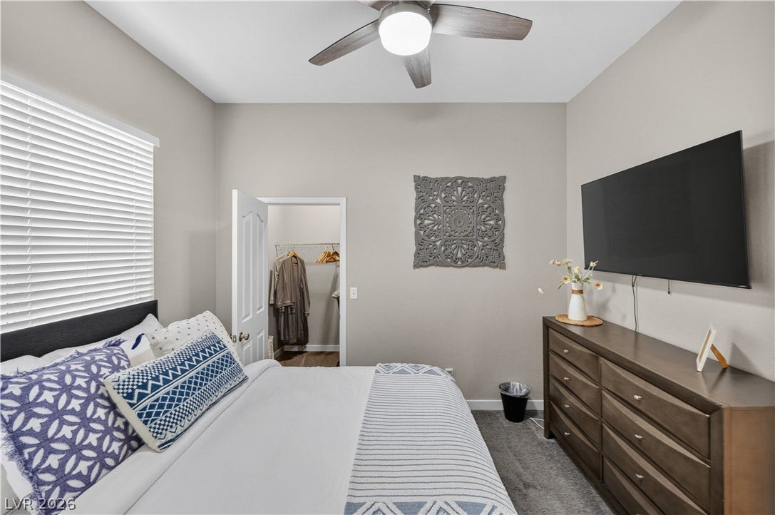 530 Rancho Del Mar Way, North Las Vegas, NV 89031 High ceilings and neutral walls define this peaceful bedroom with its adjacent walk-in closet.
