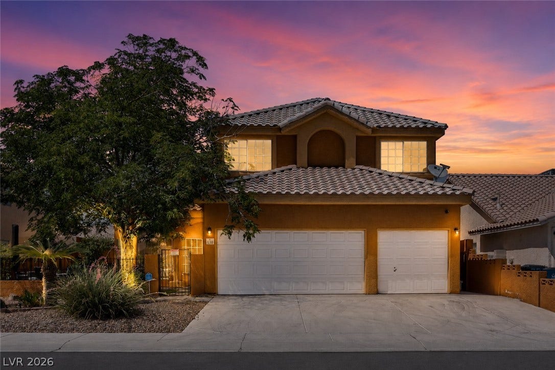 530 Rancho Del Mar Way, North Las Vegas, NV 89031 Warm stucco exterior and concrete driveway complement this two-story residence with tile roofing.