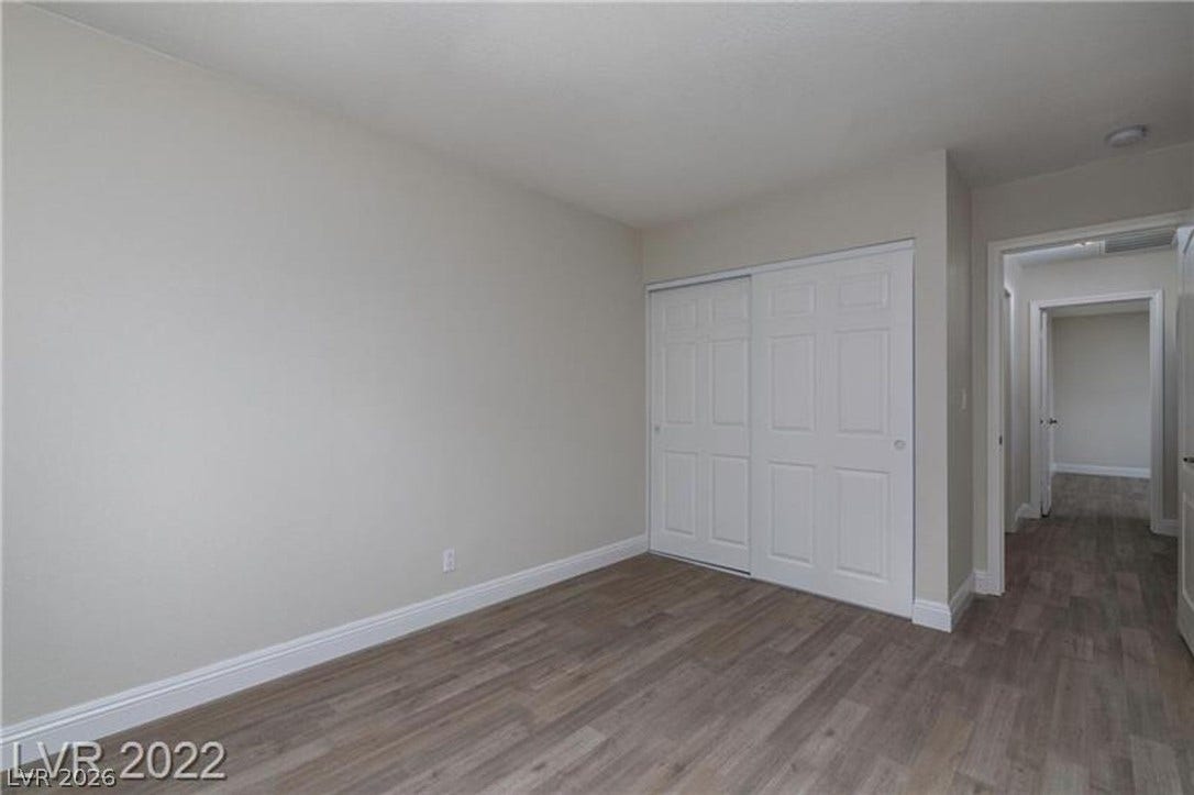 1814 N Decatur Boulevard, #202, Las Vegas, NV 89108 Smooth wood-look flooring and crisp trim define this clean, versatile bedroom space.