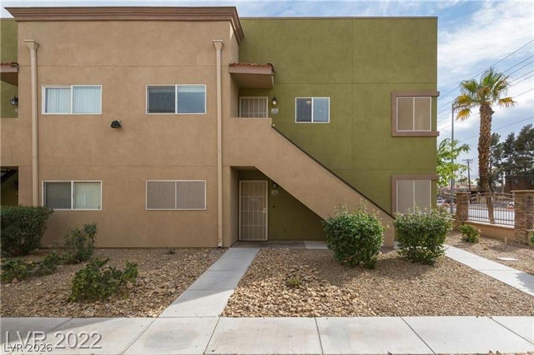 1814 N Decatur Boulevard, #202, Las Vegas, NV 89108 A concrete walkway leads to the entrance of this multi-level stucco exterior.