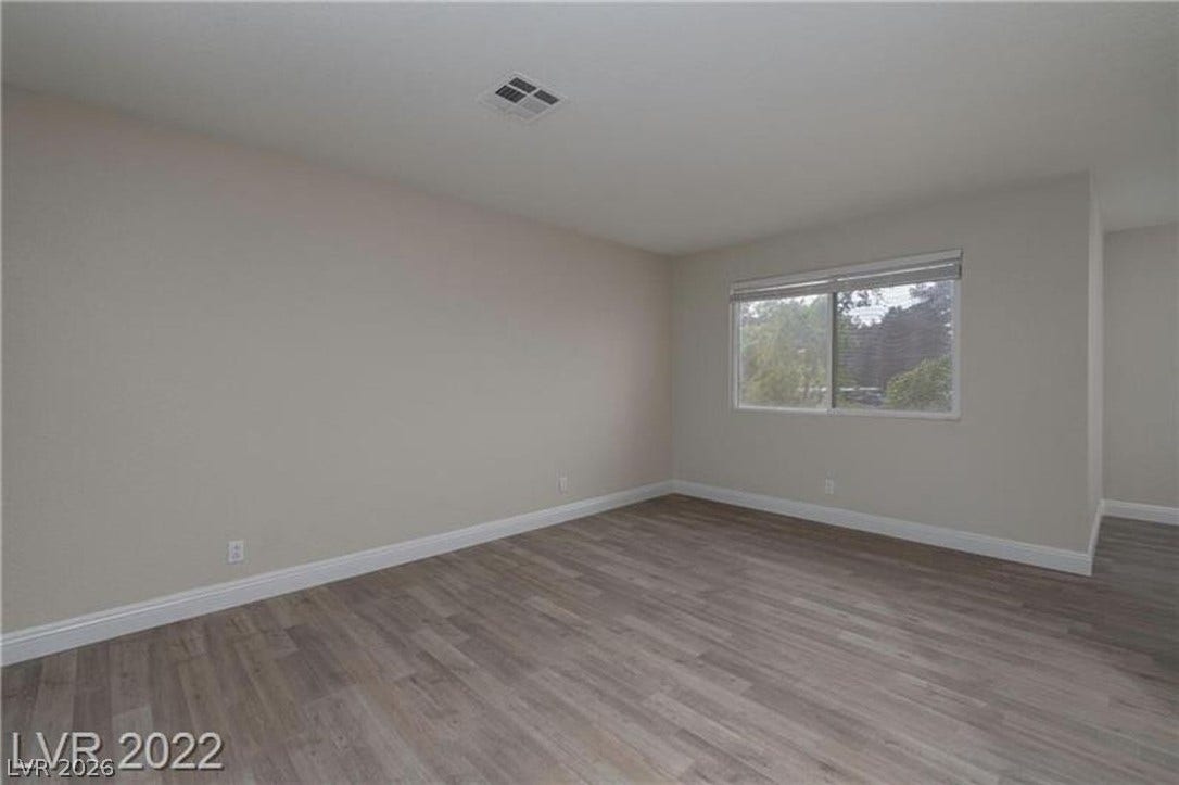 1814 N Decatur Boulevard, #202, Las Vegas, NV 89108 Plank flooring and a wide window create a clean, modern atmosphere in this versatile room.
