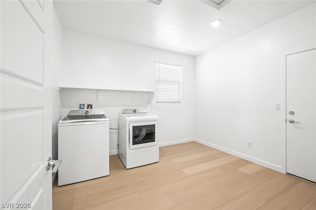 1480 Bianca Falls Drive, Henderson, NV 89011 Clean lines and smooth plank flooring define this functional home utility space.
