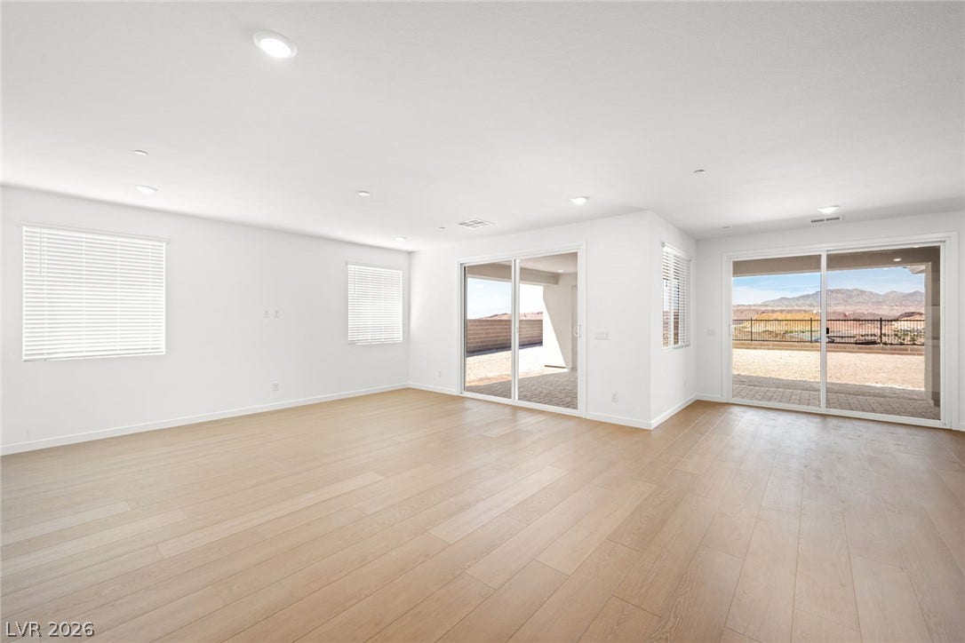 1480 Bianca Falls Drive, Henderson, NV 89011 Light wood floors complement the airy layout leading to scenic outdoor views.