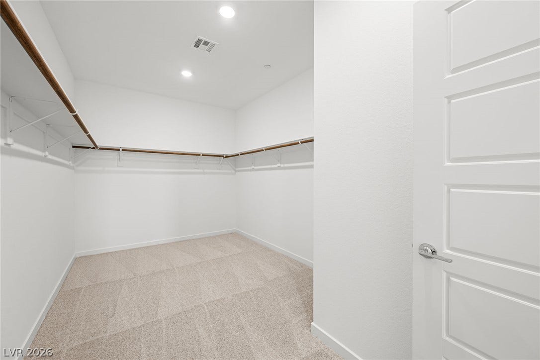 1480 Bianca Falls Drive, Henderson, NV 89011 Ample hanging rods and soft carpeting define this spacious closet.
