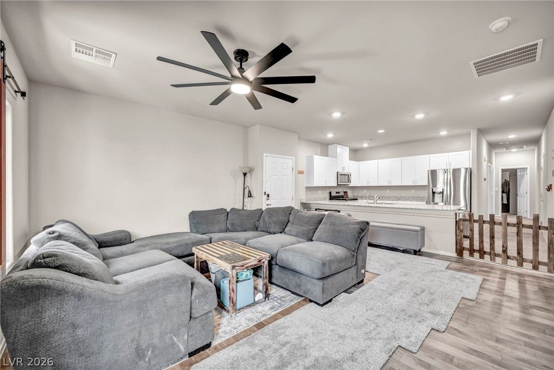 An open floorplan seamlessly connects the comfortable living area directly to the kitchen.