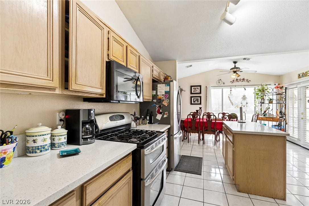 1747 Ashburn Drive, North Las Vegas, NV 89032 Gleaming tile floors and vaulted ceilings enhance this open, functional kitchen space.