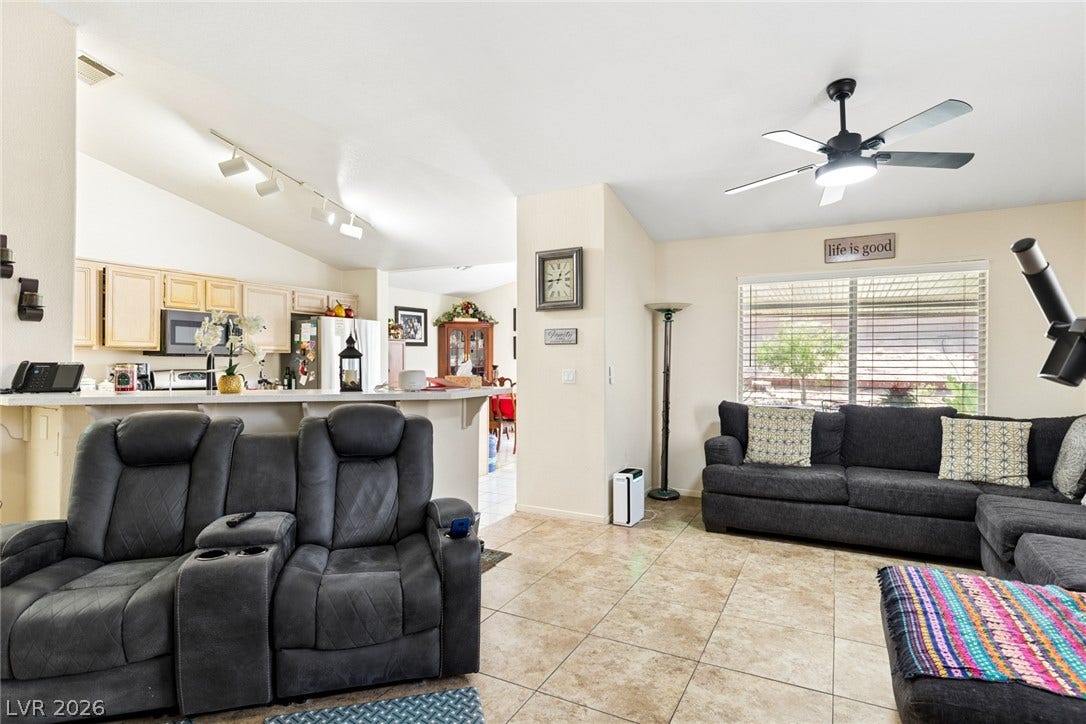 1747 Ashburn Drive, North Las Vegas, NV 89032 An open layout connects the tiled living space directly to the kitchen area.